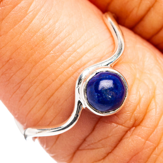 Sterling silver lapis lazuli ring with round blue gemstone, wavy band