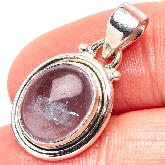 Oval aquamarine pendant in .925 sterling silver, bezel-set gemstone on hinged bail