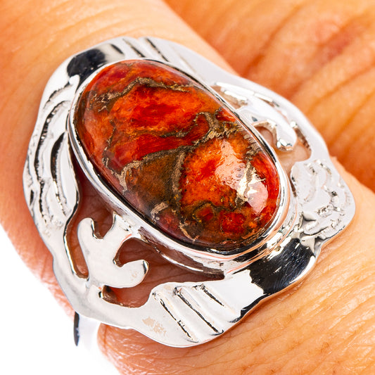 Sterling silver ring with oval copper sponge coral gemstone and ornate engraved band
