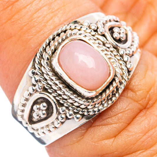 Pink opal ring in size 7, .925 sterling silver with oval pink gemstone and ornate setting