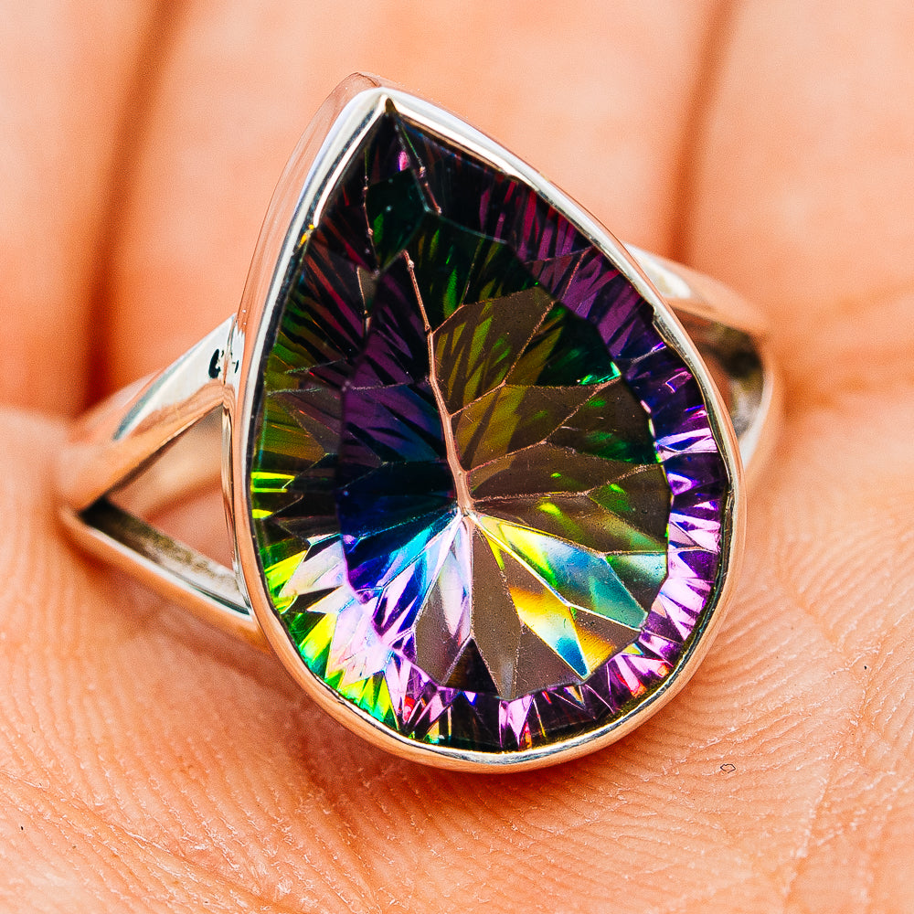 Sterling silver mystic topaz ring with pear-shaped faceted gemstone, prismatic rainbow.