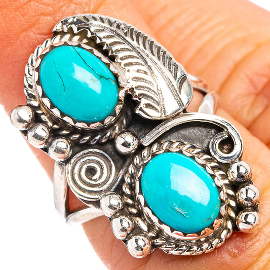 Turquoise oval cabochon ring in .925 sterling silver with ornate side details