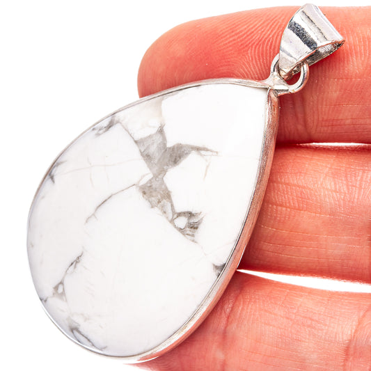 Howlite teardrop pendant with white stone and silver-plated bail, close-up