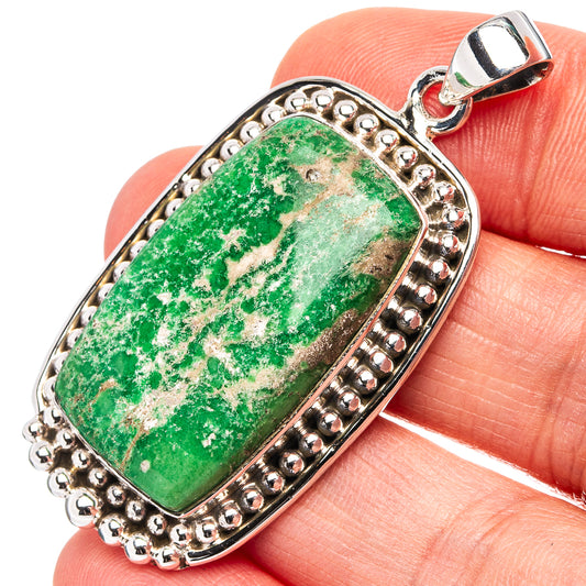 Oval green variscite pendant set in sterling silver with beaded bezel and bail