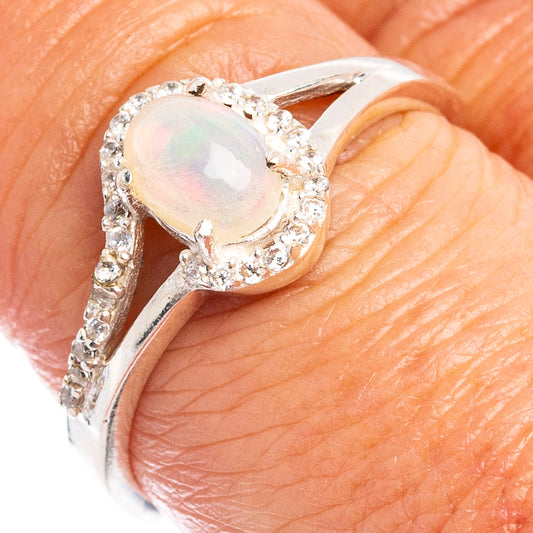 Sterling silver ring with oval Ethiopian opal and cubic zirconia halo, size 8
