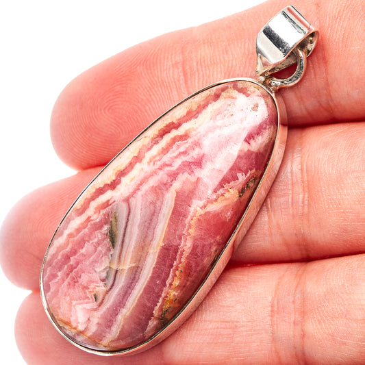 Rhodochrosite oval pendant with close-up of pink striped stone and .925 sterling silver bail