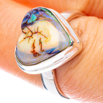 Heart-shaped opal sterling silver ring with iridescent blue-green heart stone