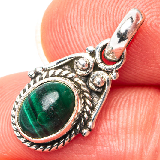 Oval malachite pendant in .925 sterling silver, ornate bezel with loop bail