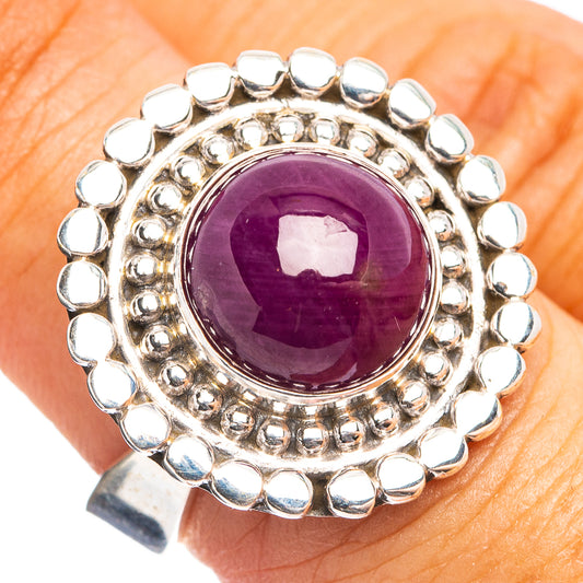 Sterling silver ring with round purple star ruby cabochon and beaded halo setting