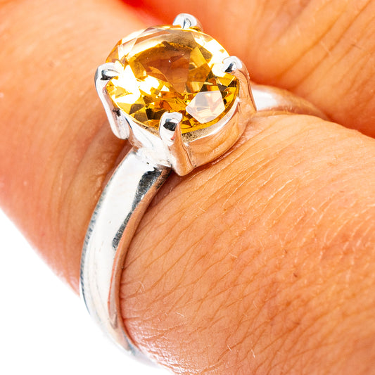 Sterling silver ring with faceted yellow citrine center stone and prong setting
