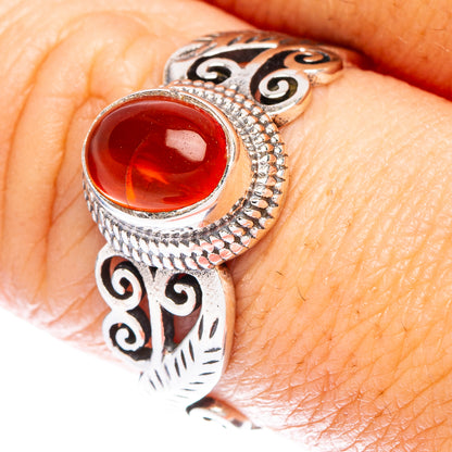 Sterling silver dainty ring with red carnelian cabochon and ornate filigree setting