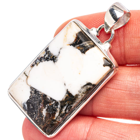 Rectangular sterling silver pendant with white buffalo turquoise stone and bail, close-up