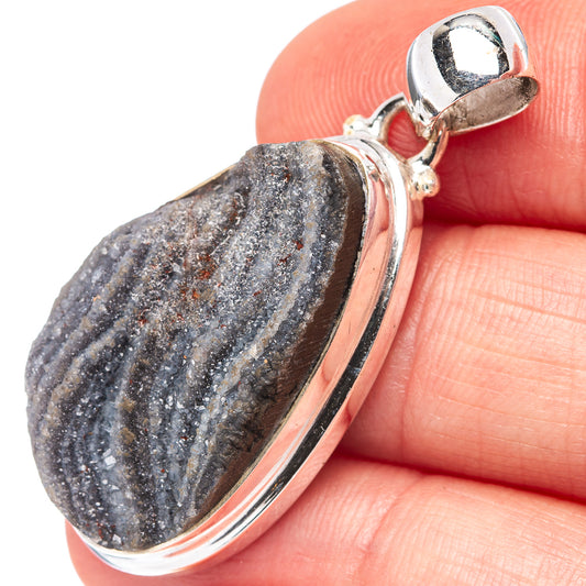 Oval druzy pendant in .925 silver bezel, dark blue-gray sparkle stone close-up on bail