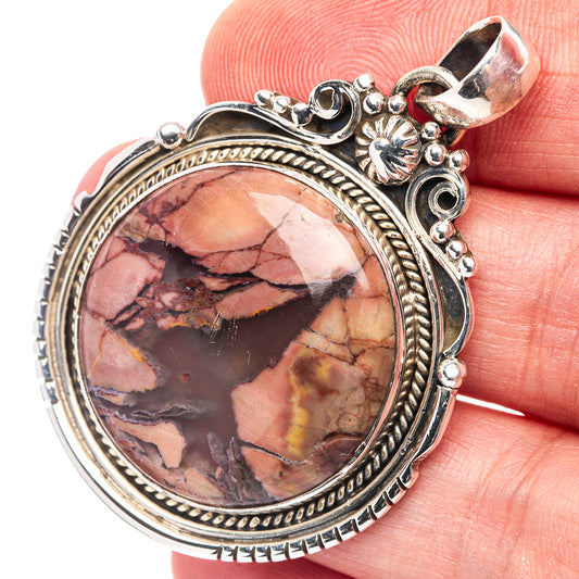 Butterfly jasper pendant in .925 sterling silver with round cabochon stone bezel
