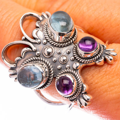 Ornate sterling silver ring with blue fluorite and purple amethyst stones, prong-set