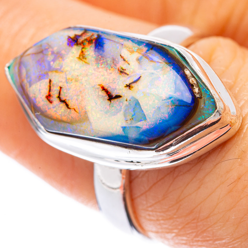 Sterling silver opal ring, iridescent blue-and-gold stone in bezel setting