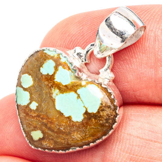 Sterling silver heart pendant with turquoise stone in open bezel setting
