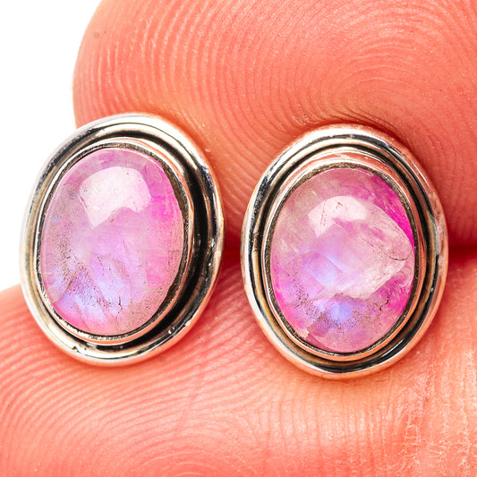Close-up of pink moonstone stud earrings with oval sterling silver settings