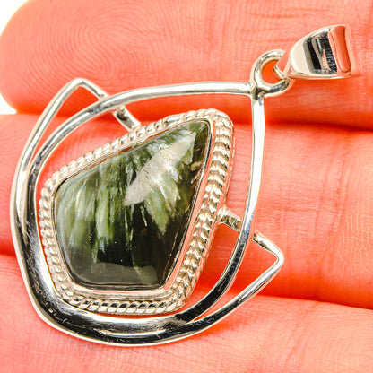 Sterling silver seraphinite pendant with green marquise-cut stone and ornate bezel