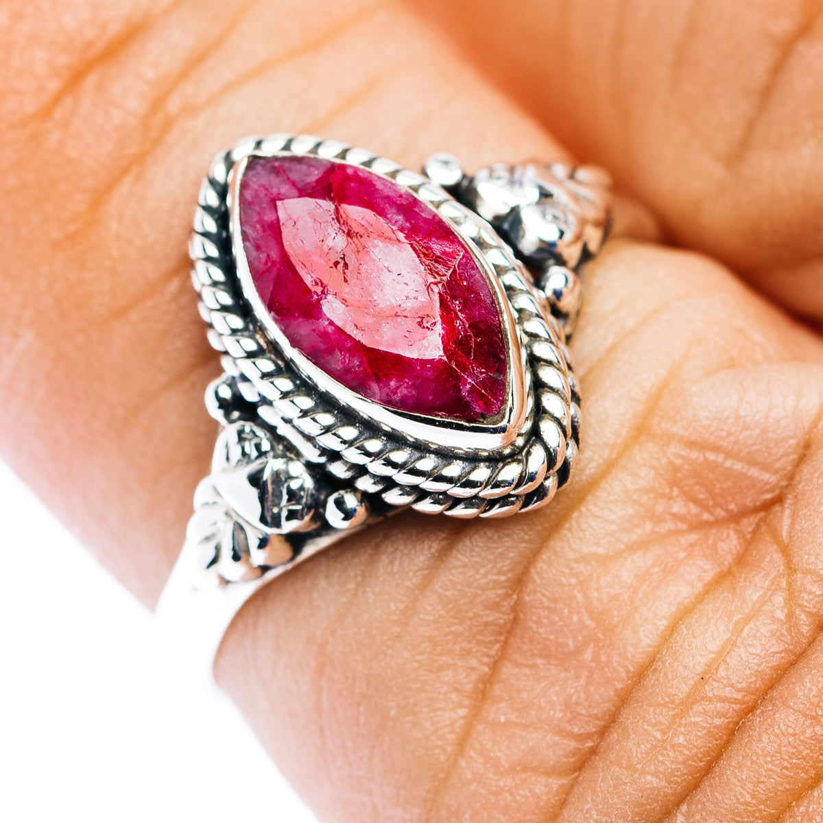 Sterling silver oval ruby ring with dainty bezel and twisted rope setting