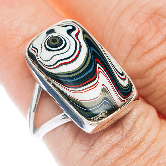 Sterling silver ring with oval inlaid fordite mosaic, black and red swirl pattern