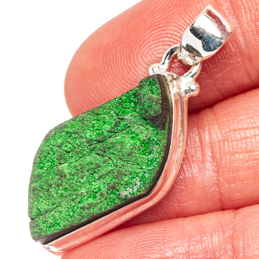 Uvarovite garnet pendant close-up: bezel-set vivid green stone in .925 silver