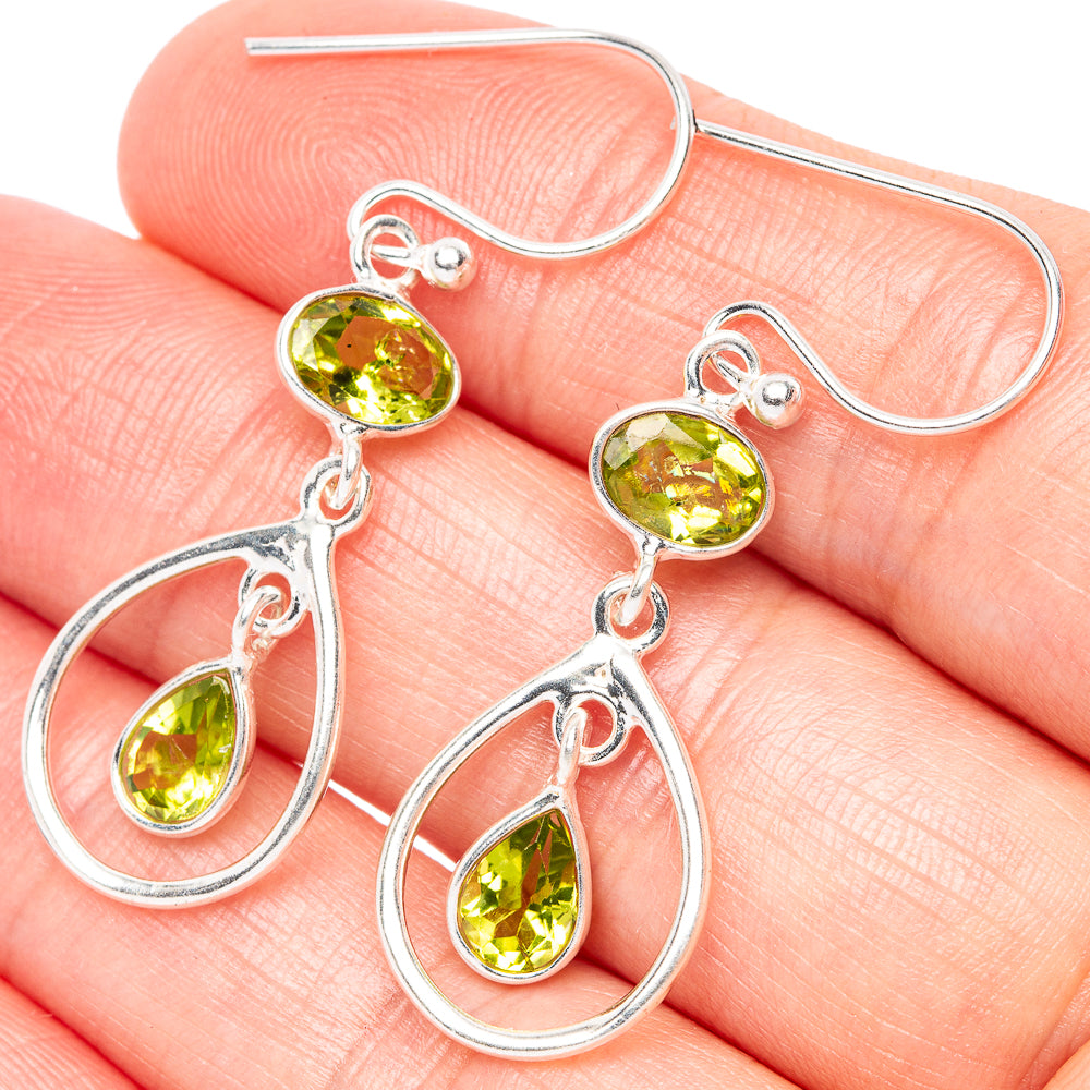 Sterling silver peridot teardrop dangle earrings with round green stones and teardrop hoops