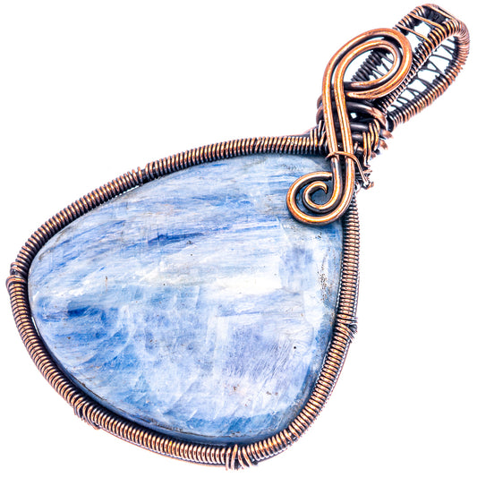 Kyanite wire-wrap pendant with oxidized copper frame and teardrop blue stone