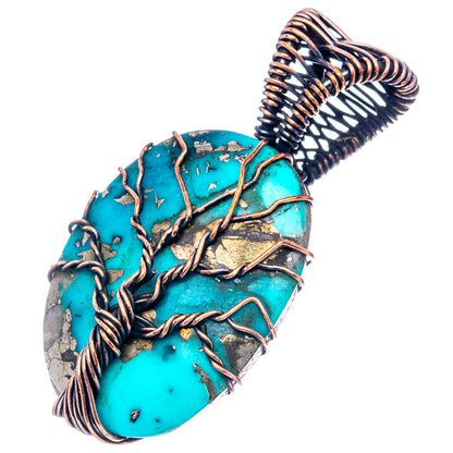 Turquoise oval pendant with oxidized copper spiral bail and wire-wrapped stone