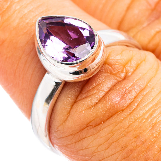 Sterling silver ring with faceted purple amethyst oval gemstone on top