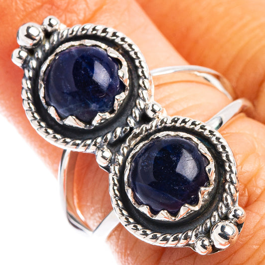 Sterling silver sodalite ring with dark blue round cabochon and ornate scalloped frame