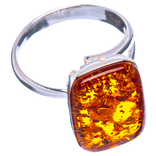 Square amber resin face on a silver adjustable ring