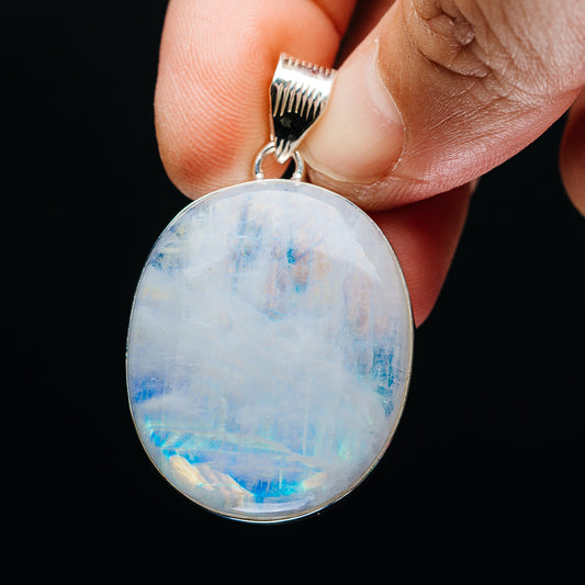 Sterling silver rainbow moonstone pendant, oval opalescent stone with blue iridescence