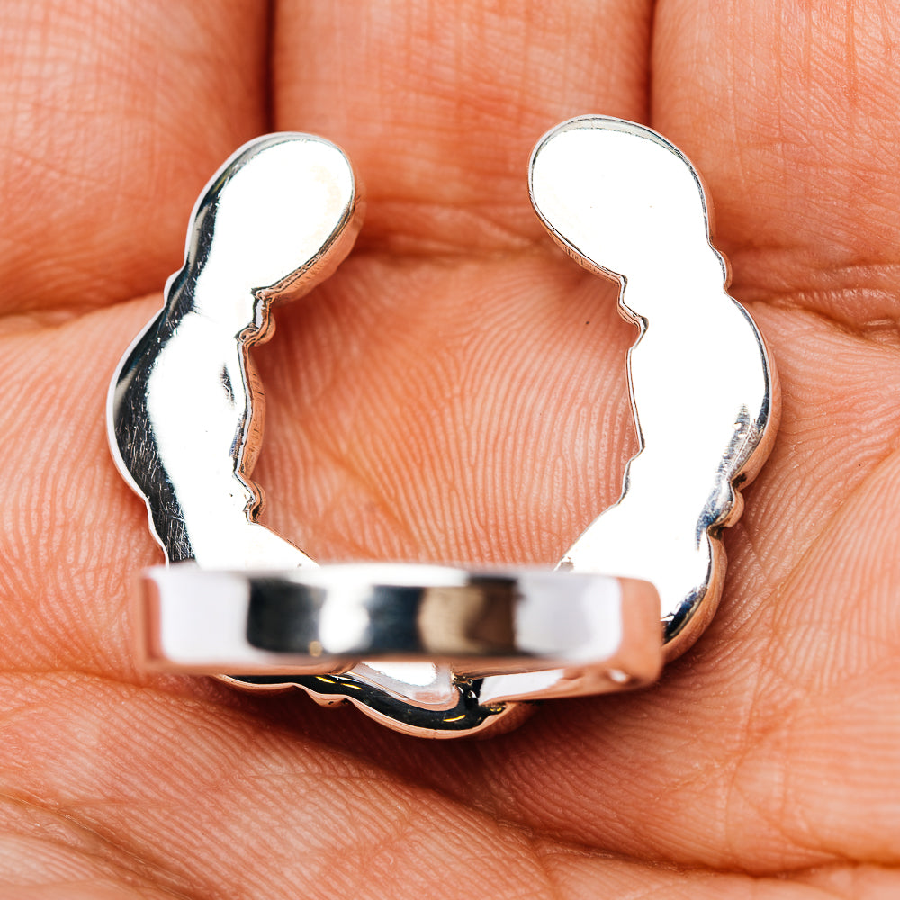 Sterling silver ring band with scalloped openwork, close-up on band