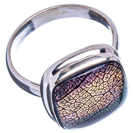 Sterling silver oval opal ring with glossy iridescent stone set in raised bezel