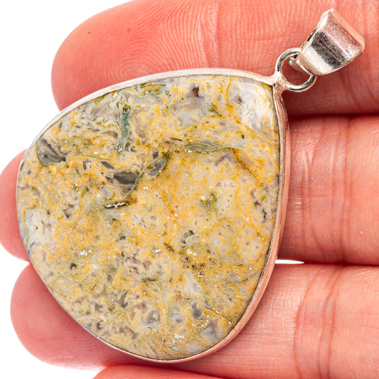 Moss agate pendant in teardrop bezel, white stone with yellow-gold and green streaks