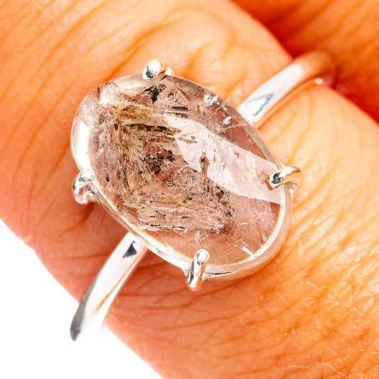 Oval faceted cacoxenite ring with clear smoky stone bezel-set in .925 sterling silver