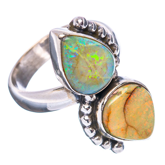 Sterling silver adjustable ring with two oval opal cabochons, green and orange glow