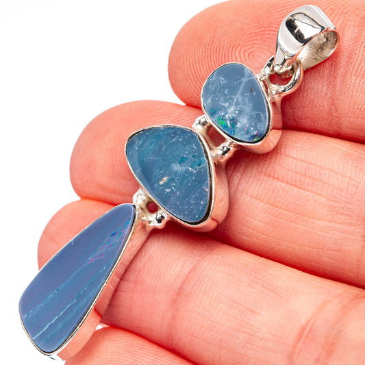 Sterling silver opal doublet pendant with three blue oval stones in bezel settings