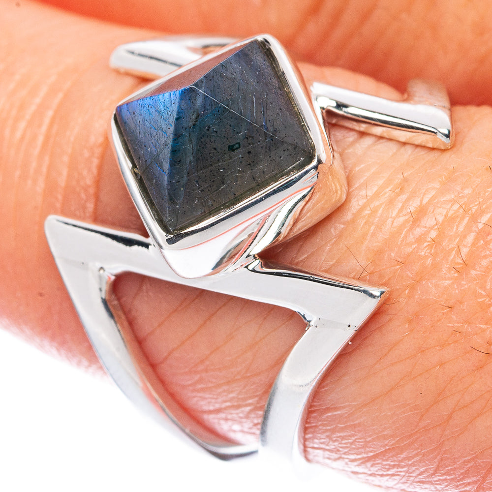 Sterling silver ring showing dark square labradorite gemstone in prong setting