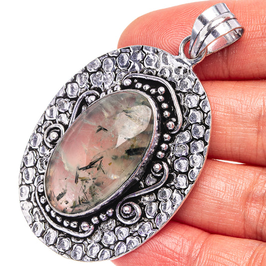 German silver oval pendant with bezel-set pale green prehnite and textured border