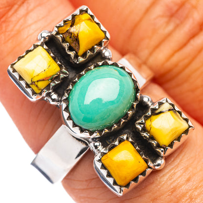 Adjustable sterling silver ring with oval turquoise and four yellow stone accents
