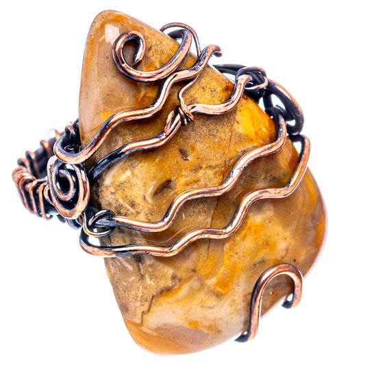 Oxidized copper wire-wrap ring with amber root stone, bead-like wire details