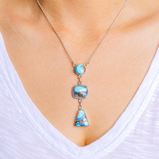 Turquoise sterling silver necklace with three blue stone pendants on a fine chain