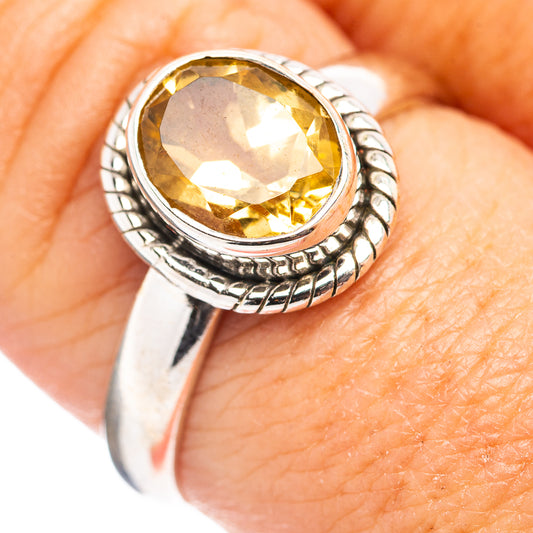 Sterling silver citrine ring with oval yellow gemstone, beaded bezel