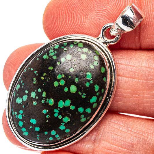 Sterling silver turquoise pendant with oval stone, black base with green speckled pattern