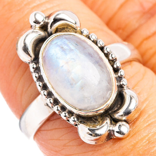 Oval moonstone ring in sterling silver with domed frame and scalloped edges