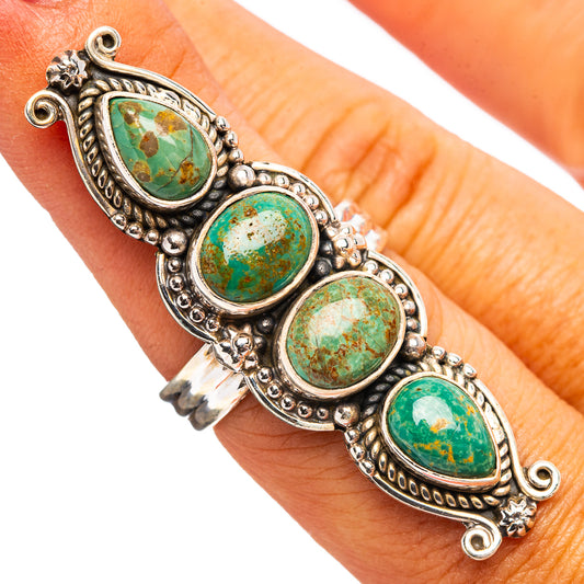 Turquoise cabochon cluster ring with four oval stones in ornate silver settings