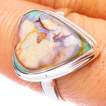 Heart-shaped opal set in sterling silver ring with iridescent multicolor stone