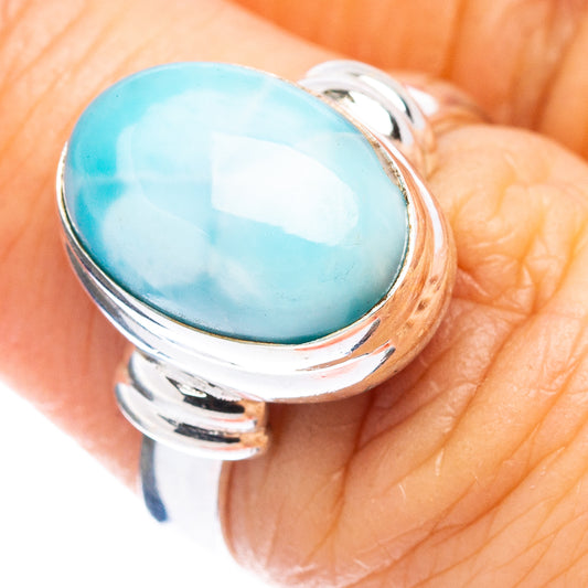 Sterling silver larimar ring with oval light-blue gemstone, polished bezel, top view